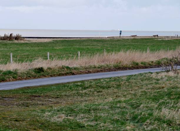 istock Canal flows through North Sea coastal landscape 1405901893