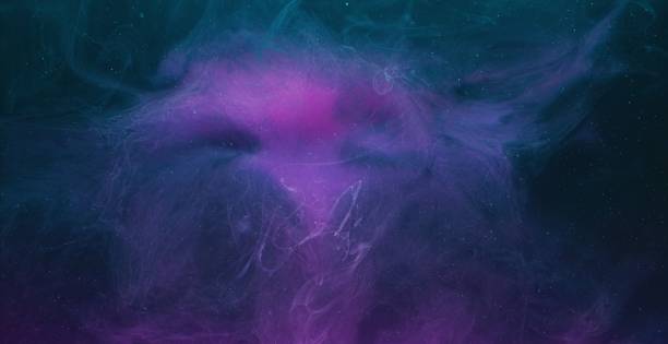 istock color fluid mix smoke cloud motion purple blue ink 1405906893