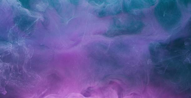 istock ink water mix magic burst blue purple paint blend 1405906905