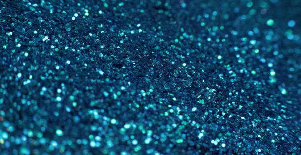 istock glitter fluid defocused golden sequin glow 1405906920