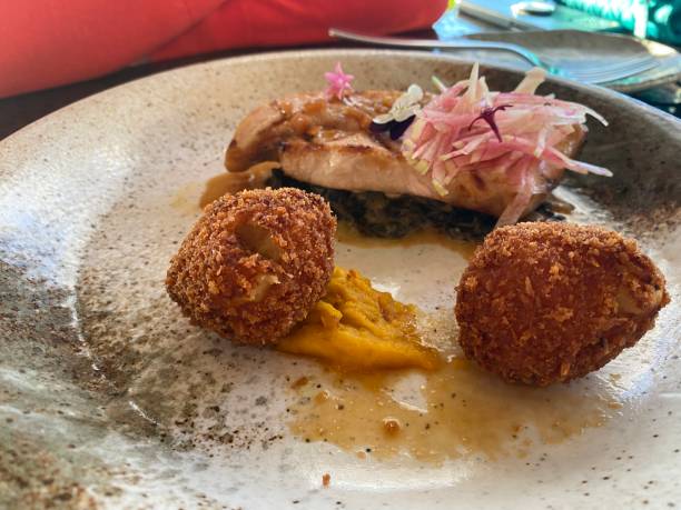 istock Asian Poached Fish with Fried Croquettes 1405907450
