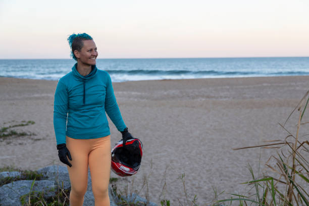 istock Woman with smile on the beach 1405910207