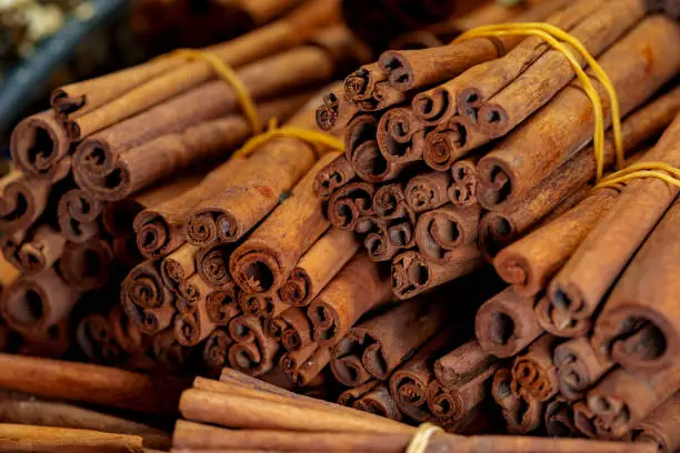Cinnamon sticks.for sale on stall in market, close up