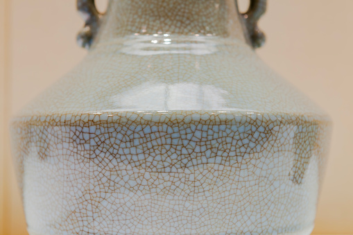 Partial close-up of the body of the porcelain jar, with cracked features