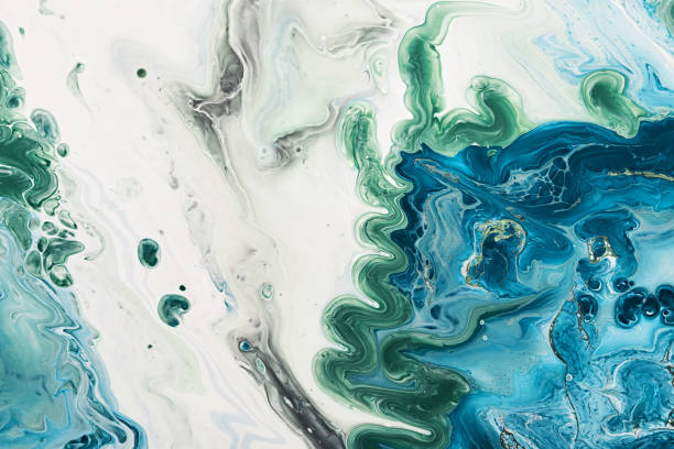 istock Fluid Art acrylic paints. Abstract mixing blue and green waves on white background. Liquid flows splashes. Marble effect background or texture 1405920757