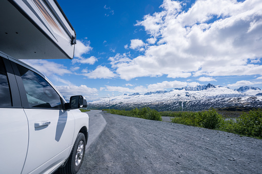 Recreational Vehicle driving to the Alaska Range mountains  of long highway