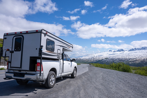 Recreational Vehicle driving to the Alaska Range mountains  of long highway