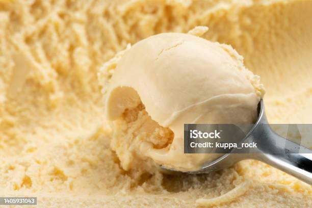 Scoop The Vanilla Ice Cream With An Ice Cream Scoop Stock Photo - Download Image Now