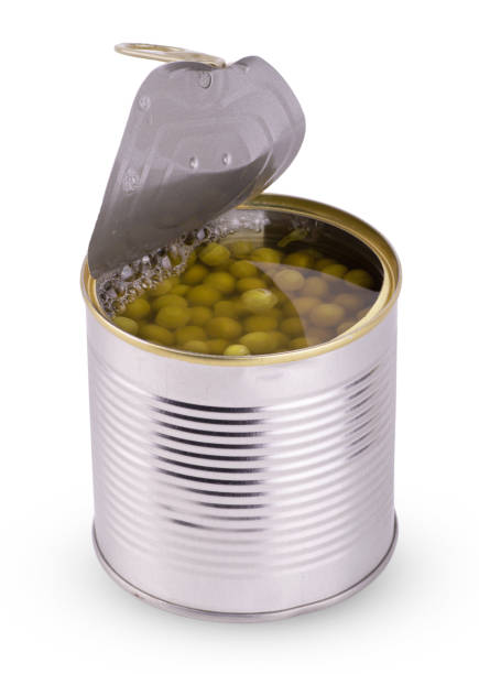 istock Open jar with canned green peas isolated on a white background close up 1405932195