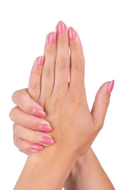 istock Woman's hands with pink nails manicure Isolated on white background. 1405932648