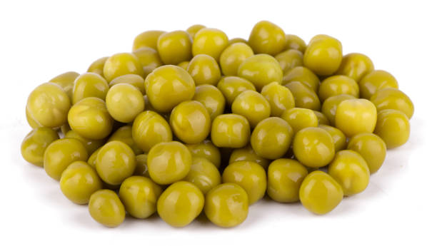 istock Green canned peas isolated on white background close up 1405932757