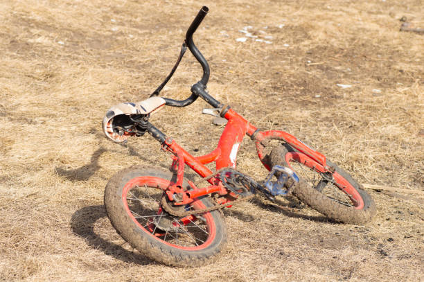 istock Be careful while driving by bike lying on the grass falling from a bicycle 1405932828