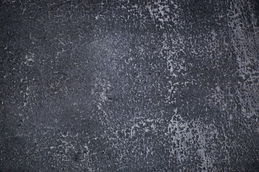 black granite background with cement.