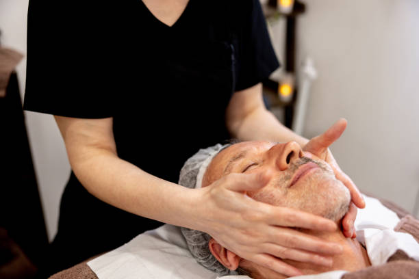 istock Man at the spa getting a facial 1405935274