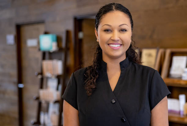 istock Happy woman working at a spa 1405935311