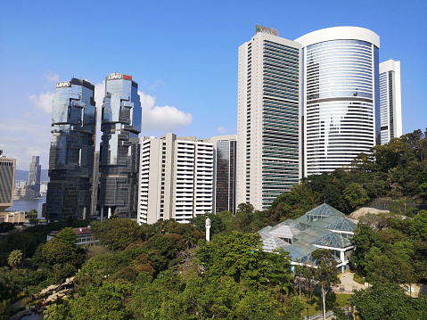 Lippo Centre, a postmodern twin-tower skyscraper complex in Admiralty on Hong Kong Island, viewed from Hong Kong Park.