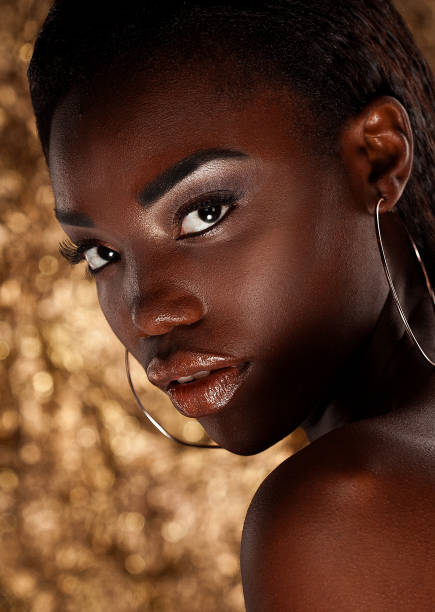 istock Beautiful young African woman with bright make up 1405942118