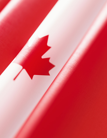 Canadian flag background. Vertical composition with copy space. Great use for Canada related concepts.