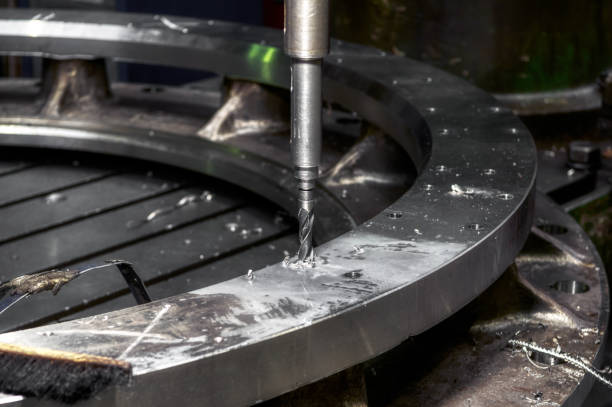 istock Drilling a hole in a large metal ring. Radial vertical drilling machine. 1405951077