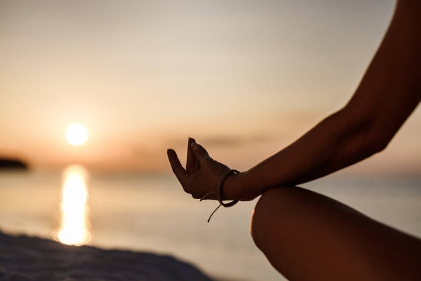 istock Meditating on the beach at sunrise! 1405952858