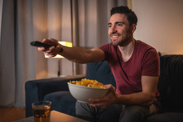 istock Single Caucasian Man Enjoying A Basketball Match At Home 1405952995
