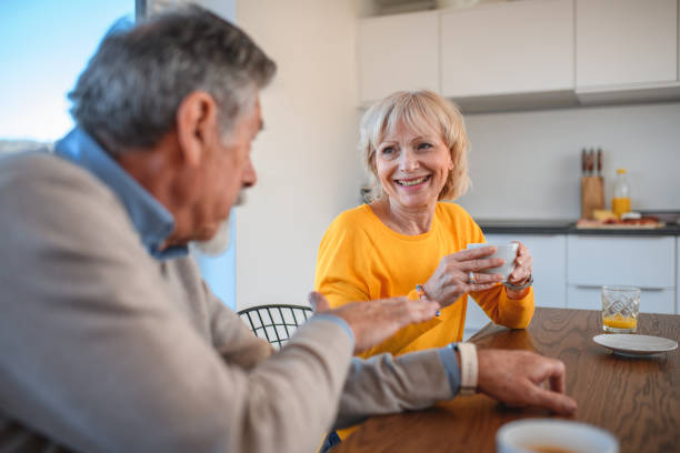 istock Caucasian Senior Couple Laughing Together While Having Breakfast 1405953264