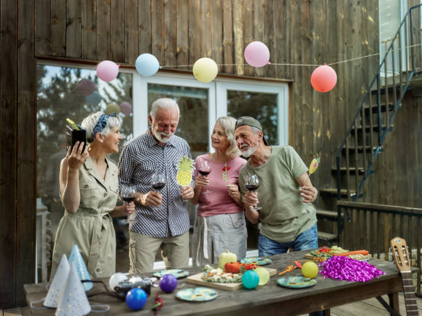 istock Happy mature couples having a party on a patio. 1405954026