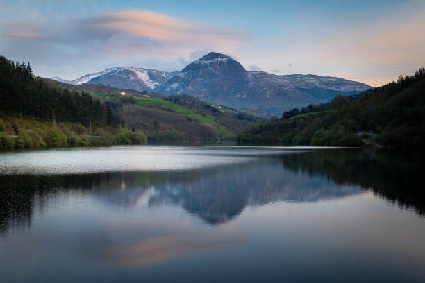 istock Ibiur reservoir with Txindoki mountain as background, Basque Country in Spain 1405954164