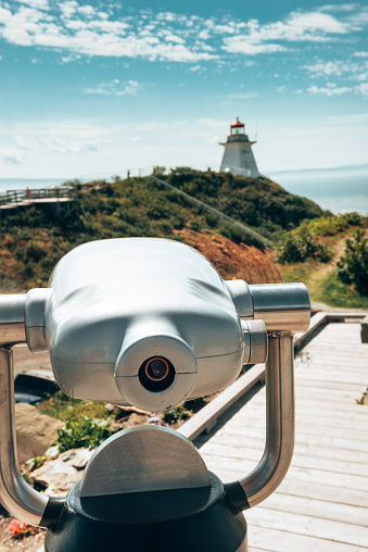 binocular pointing the lighthouse in canada