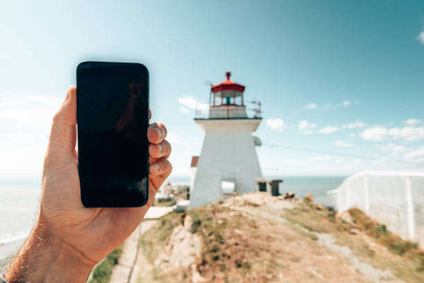 istock photographing the lighthouse in canada 1405954313