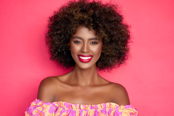 istock Cheerful black woman with curly hair 1405955401