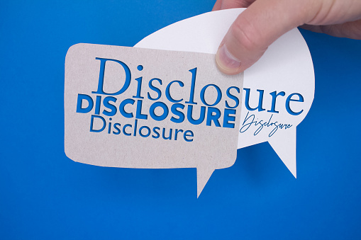 Speech bubble in front of colored background with Disclosure text.