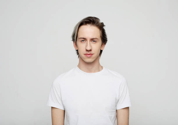 istock young man wear white t-shirt looking at camera on grey background 1405958629