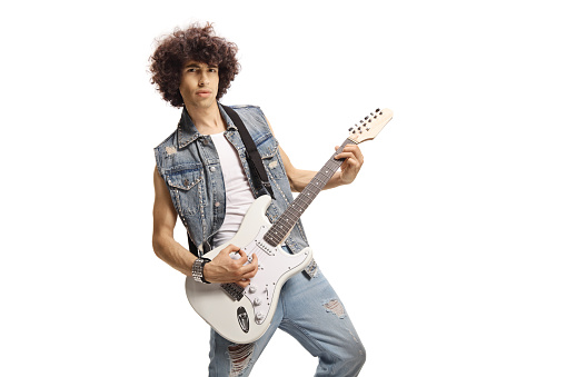 Male musician playing a white electric guitar isolated on white background