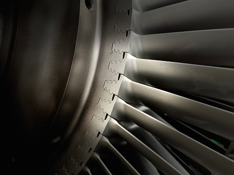 Aircraft jet engine maintenance and inspection in the airplane hangar.