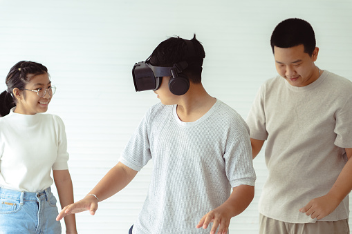 A few students wears a virtual reality augmented reality headset in Bangkok, Thailand.