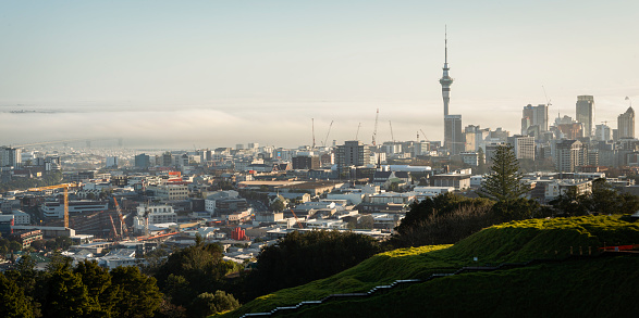 Panorama view of Auckland city in the fog. Photo taken from Mt Eden summit.