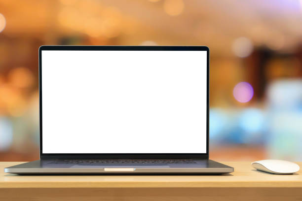 istock Laptop with blank screen on wood table with cafe coffee shop blur background 1405964635