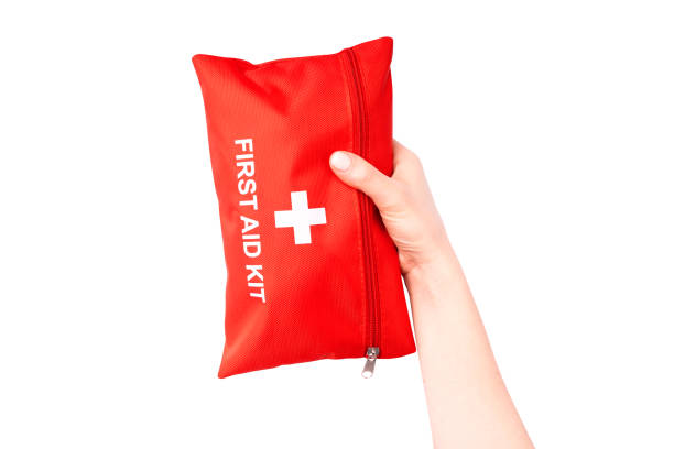 istock First Aid Kit in female hands isolated on white. Ready for clipping path. 1405964687