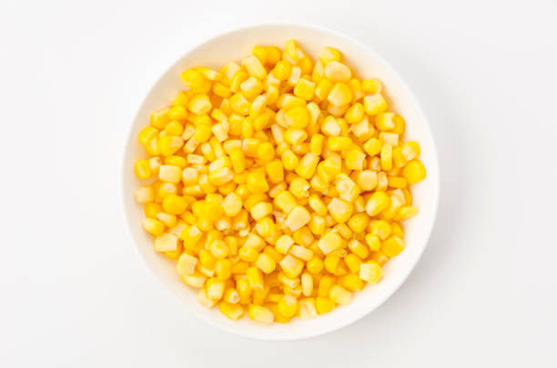 istock Canned sweet corn on a white plate on white background 1405964797