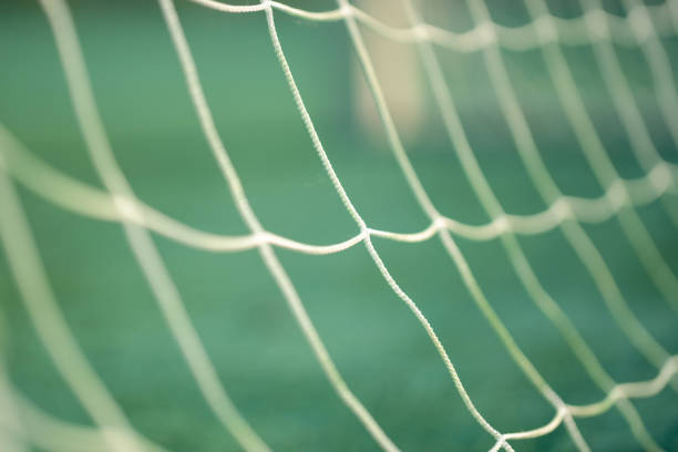 Close-up of white soccer goal net Close-up of white soccer goal net sito maglie calcio stock pictures, royalty-free photos & images