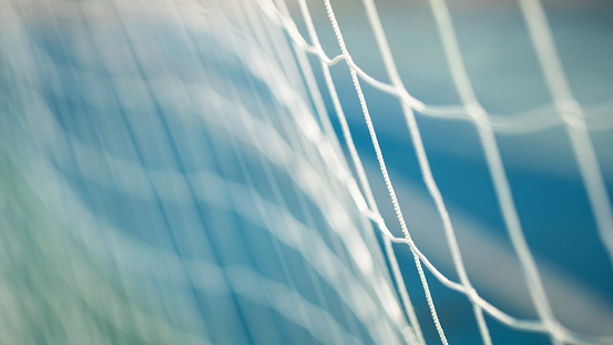 Close-up of white soccer goal net