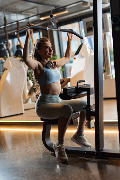 istock Athletic woman exercising in a gym 1405965162