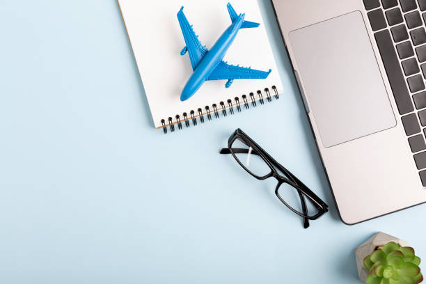 istock View home desk with airplane model and notebook 1405969385