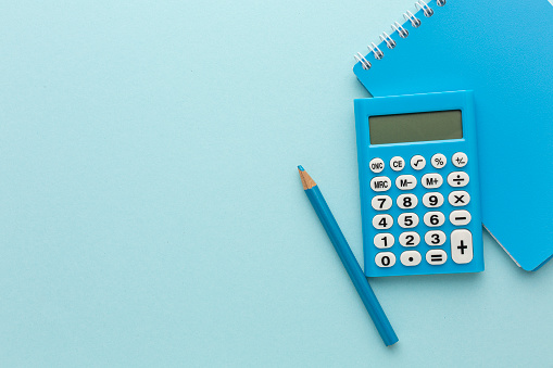 blue calculator on a colored background. High quality photo