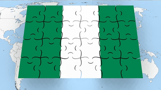 Grunge map of Burkina Faso with its flag printed within its border on an old paper.
