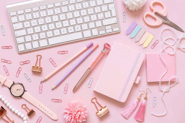 istock Notebook, Pink school girly accessories and keyboard on pastel pink Top view, mockup 1405973857