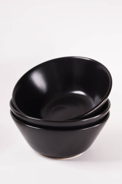 istock Black color bowls on the white background 1405976721