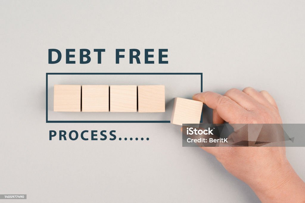 The words debt free in process are standing next to the loading bar, ending credit payments and bank loans, financial freedom Debt Stock Photo