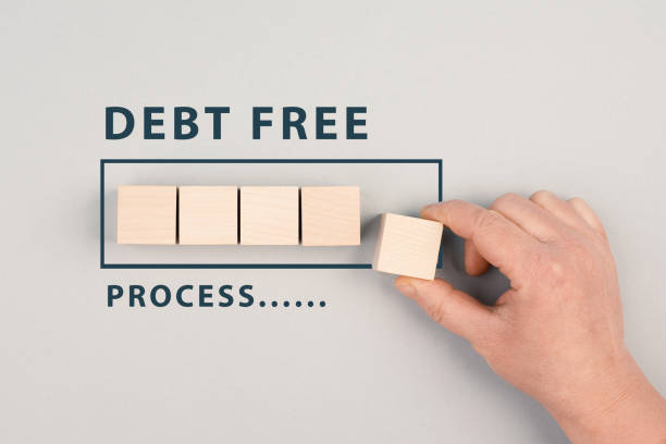 The words debt free in process are standing next to the loading bar, ending credit payments and bank loans, financial freedom stock photo
